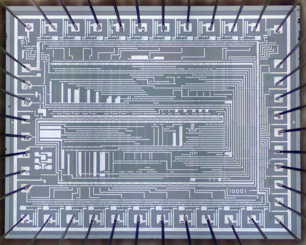 Reverse-engineering an early calculator chip with four-phase logic