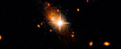 Hubble detects supermassive black hole kicked out of galactic core