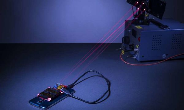 Using a laser to wirelessly charge a smartphone safely across a room