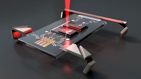 Laser jolts microscopic electronic robots into motion